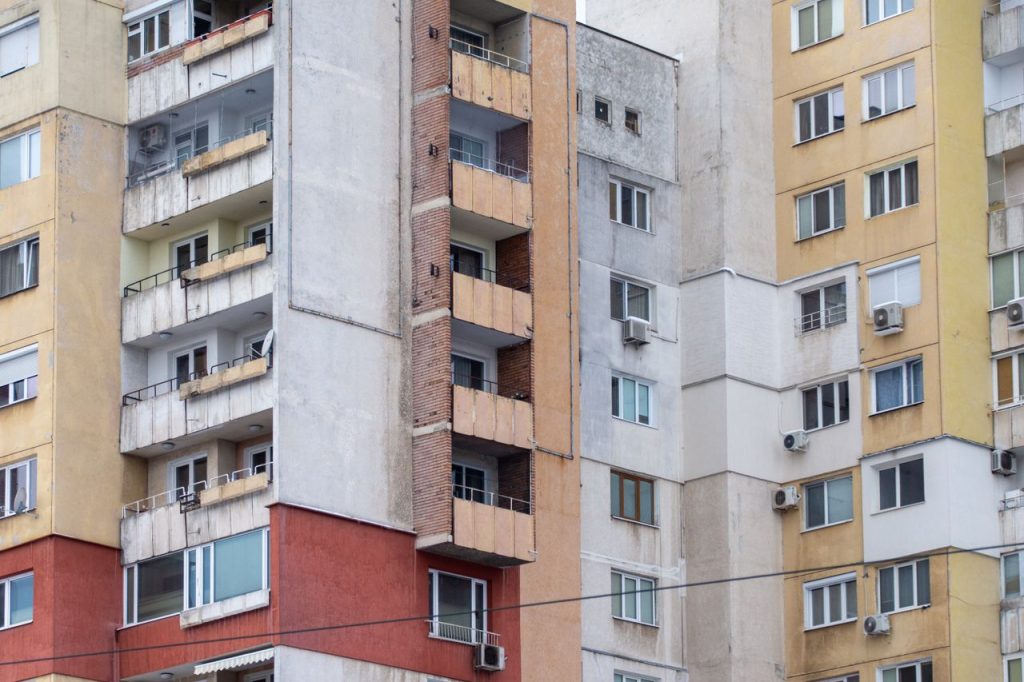 Close-up view of urban residential apartment buildings showcasing diverse architectural styles.